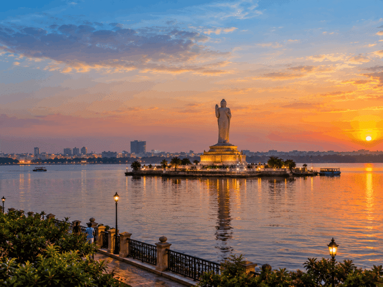 Hussain Sagar Lake and Buddha statue at sunset.